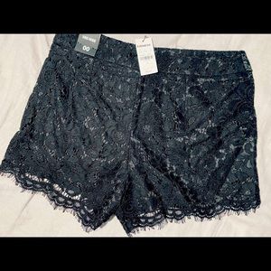 Express black lace mid rise shorts.